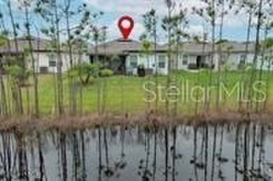 This MOVE- IN READY, LIKE NEW, WATERFRONT home, built in 2022 is on Grand Reserve Golf Course in Florida - for sale on GolfHomes.com, golf home, golf lot