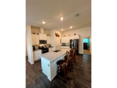 This MOVE- IN READY, LIKE NEW, WATERFRONT home, built in 2022 is on Grand Reserve Golf Course in Florida - for sale on GolfHomes.com, golf home, golf lot