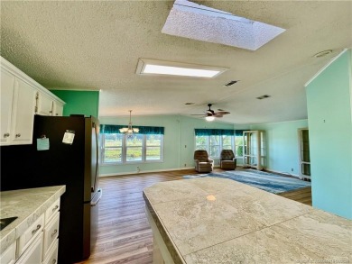 What a view! Canal! Wildlife! Golf! You have it all from your on Indianwood Golf and Country Club in Florida - for sale on GolfHomes.com, golf home, golf lot