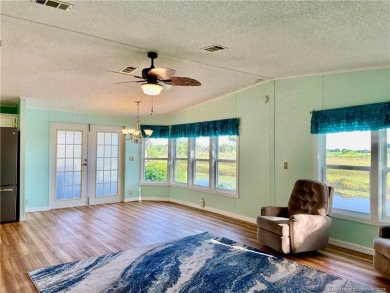 What a view! Canal! Wildlife! Golf! You have it all from your on Indianwood Golf and Country Club in Florida - for sale on GolfHomes.com, golf home, golf lot
