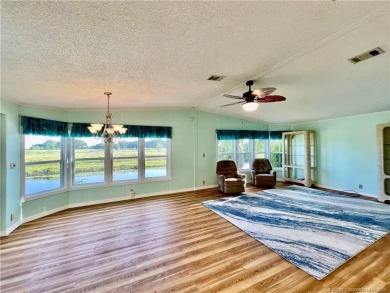 What a view! Canal! Wildlife! Golf! You have it all from your on Indianwood Golf and Country Club in Florida - for sale on GolfHomes.com, golf home, golf lot