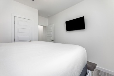 Gorgeous 4 bedroom townhome with water view in town! This 3 on Palmilla Beach Golf Club in Texas - for sale on GolfHomes.com, golf home, golf lot