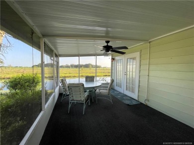 What a view! Canal! Wildlife! Golf! You have it all from your on Indianwood Golf and Country Club in Florida - for sale on GolfHomes.com, golf home, golf lot