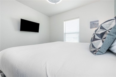 Gorgeous 4 bedroom townhome with water view in town! This 3 on Palmilla Beach Golf Club in Texas - for sale on GolfHomes.com, golf home, golf lot