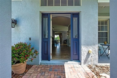 Commanding golf course views and elegant architectural details on Heritage Harbor Golf and Country Club in Florida - for sale on GolfHomes.com, golf home, golf lot
