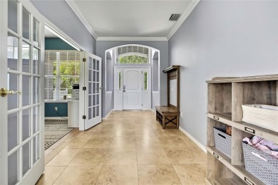 Commanding golf course views and elegant architectural details on Heritage Harbor Golf and Country Club in Florida - for sale on GolfHomes.com, golf home, golf lot