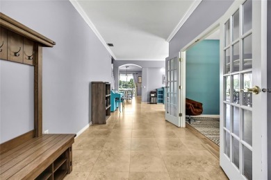 Commanding golf course views and elegant architectural details on Heritage Harbor Golf and Country Club in Florida - for sale on GolfHomes.com, golf home, golf lot