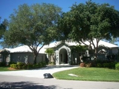Discover this elegant three-bedroom + den, four-bath pool home on Fiddlesticks Country Club in Florida - for sale on GolfHomes.com, golf home, golf lot