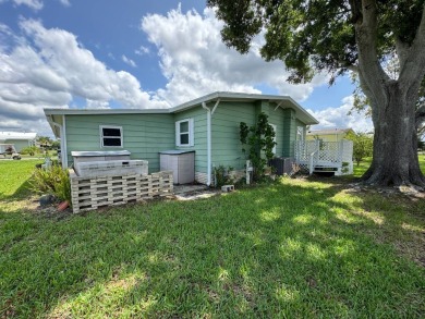 Don't miss this immaculate 2/2, 1248 sf home in the highly on Lake Henry Golf Club in Florida - for sale on GolfHomes.com, golf home, golf lot
