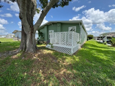 Don't miss this immaculate 2/2, 1248 sf home in the highly on Lake Henry Golf Club in Florida - for sale on GolfHomes.com, golf home, golf lot