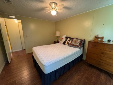 Don't miss this immaculate 2BR/2BA, 1248 sq. ft. home in the on Lake Henry Golf Club in Florida - for sale on GolfHomes.com, golf home, golf lot