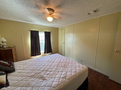 Don't miss this immaculate 2BR/2BA, 1248 sq. ft. home in the on Lake Henry Golf Club in Florida - for sale on GolfHomes.com, golf home, golf lot