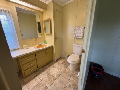 Don't miss this immaculate 2BR/2BA, 1248 sq. ft. home in the on Lake Henry Golf Club in Florida - for sale on GolfHomes.com, golf home, golf lot