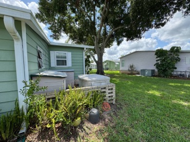 Don't miss this immaculate 2BR/2BA, 1248 sq. ft. home in the on Lake Henry Golf Club in Florida - for sale on GolfHomes.com, golf home, golf lot