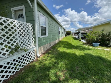 Don't miss this immaculate 2BR/2BA, 1248 sq. ft. home in the on Lake Henry Golf Club in Florida - for sale on GolfHomes.com, golf home, golf lot