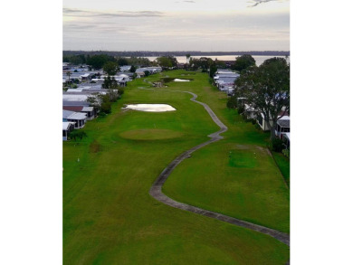 Don't miss this immaculate 2BR/2BA, 1248 sq. ft. home in the on Lake Henry Golf Club in Florida - for sale on GolfHomes.com, golf home, golf lot