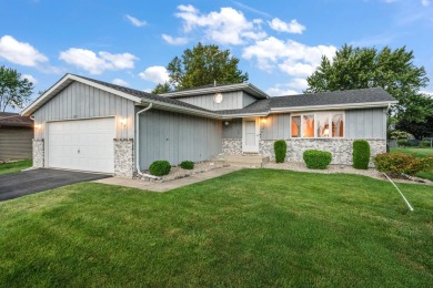 Step into this charming tri-level home in the Lakes of the Four on Lakes of the Four Seasons Country Club in Indiana - for sale on GolfHomes.com, golf home, golf lot