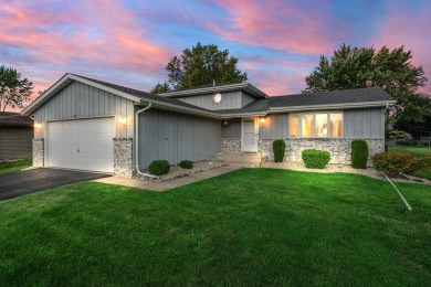 Step into this charming tri-level home in the Lakes of the Four on Lakes of the Four Seasons Country Club in Indiana - for sale on GolfHomes.com, golf home, golf lot