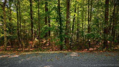 Nestled in the serene community of Seven Lakes South, this prime on Seven Lakes Country Club in North Carolina - for sale on GolfHomes.com, golf home, golf lot