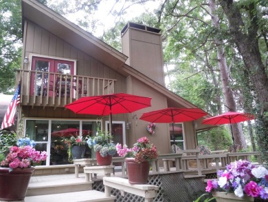 A rarity and a real beauty. Chic best describes this townhome on Holly Lake Ranch Golf Club in Texas - for sale on GolfHomes.com, golf home, golf lot