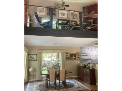 A rarity and a real beauty. Chic best describes this townhome on Holly Lake Ranch Golf Club in Texas - for sale on GolfHomes.com, golf home, golf lot