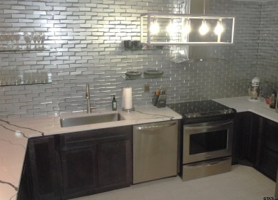 A rarity and a real beauty. Chic best describes this townhome on Holly Lake Ranch Golf Club in Texas - for sale on GolfHomes.com, golf home, golf lot