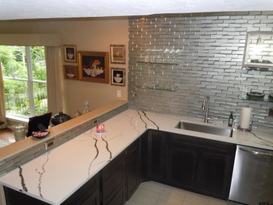 A rarity and a real beauty. Chic best describes this townhome on Holly Lake Ranch Golf Club in Texas - for sale on GolfHomes.com, golf home, golf lot