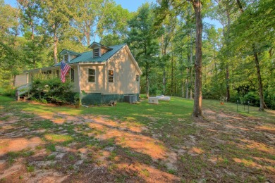 This cozy cabin is nestled among the trees with a view of the on Pendleton Harbor in Texas - for sale on GolfHomes.com, golf home, golf lot