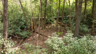 Nestled in the tranquil setting of Holly Forest IV, this on Sapphire National Golf Club in North Carolina - for sale on GolfHomes.com, golf home, golf lot