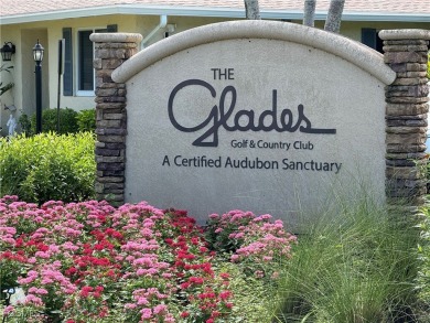 Discover the perfect blend of comfort and resort-style living in on The Glades Golf and Country Club in Florida - for sale on GolfHomes.com, golf home, golf lot
