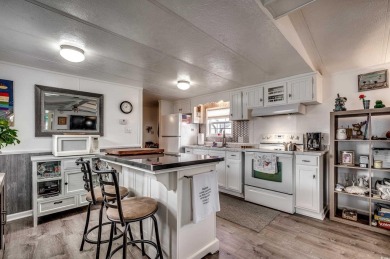 Situated on an oversized lot, this clean, bright, and move-in on Barefoot Resort and Golf Club  in South Carolina - for sale on GolfHomes.com, golf home, golf lot