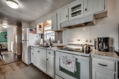 Situated on an oversized lot, this clean, bright, and move-in on Barefoot Resort and Golf Club  in South Carolina - for sale on GolfHomes.com, golf home, golf lot