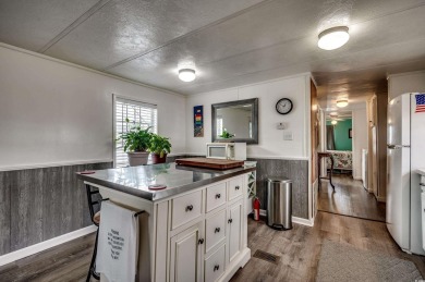 Situated on an oversized lot, this clean, bright, and move-in on Barefoot Resort and Golf Club  in South Carolina - for sale on GolfHomes.com, golf home, golf lot