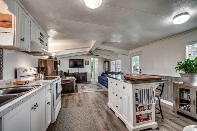 Situated on an oversized lot, this clean, bright, and move-in on Barefoot Resort and Golf Club  in South Carolina - for sale on GolfHomes.com, golf home, golf lot