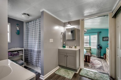 Situated on an oversized lot, this clean, bright, and move-in on Barefoot Resort and Golf Club  in South Carolina - for sale on GolfHomes.com, golf home, golf lot