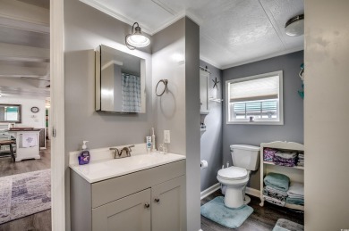 Situated on an oversized lot, this clean, bright, and move-in on Barefoot Resort and Golf Club  in South Carolina - for sale on GolfHomes.com, golf home, golf lot