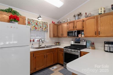 Soak up the mountains in this move-in ready home. With easy on Maggie Valley Resort and Country Club in North Carolina - for sale on GolfHomes.com, golf home, golf lot