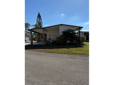 This lovely, manufactured home is on leased land in Lake on Pine Lakes Country Club in Florida - for sale on GolfHomes.com, golf home, golf lot