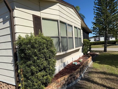 This lovely, manufactured home is on leased land in Lake on Pine Lakes Country Club in Florida - for sale on GolfHomes.com, golf home, golf lot