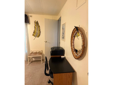 This lovely, manufactured home is on leased land in Lake on Pine Lakes Country Club in Florida - for sale on GolfHomes.com, golf home, golf lot