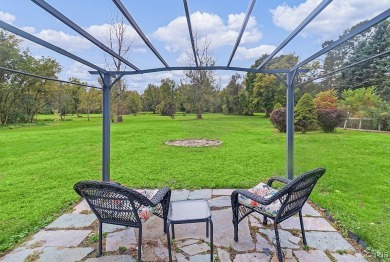 Discover the perfect blend of convenience and privacy in this on Heron Creek Golf Club in New York - for sale on GolfHomes.com, golf home, golf lot