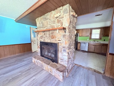 4-bedroom, 3-bath home on approximately 0.69 acres with a wet on Cherokee Village North Course in Arkansas - for sale on GolfHomes.com, golf home, golf lot