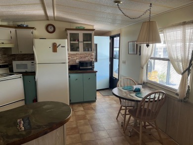 Welcome to your perfect seasonal escape! This 2-bedroom on Crystal Lake Club in Florida - for sale on GolfHomes.com, golf home, golf lot