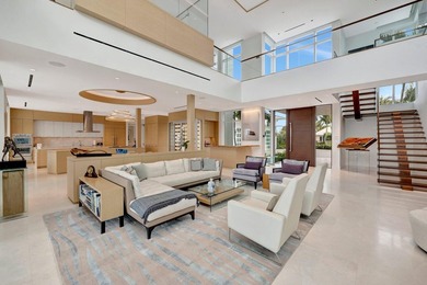 Experience the best of luxury living in this waterfront coastal on Sailfish Point Golf Club, Inc. in Florida - for sale on GolfHomes.com, golf home, golf lot