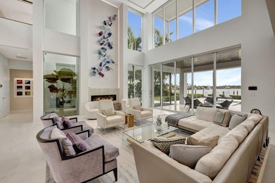 Experience the best of luxury living in this waterfront coastal on Sailfish Point Golf Club, Inc. in Florida - for sale on GolfHomes.com, golf home, golf lot