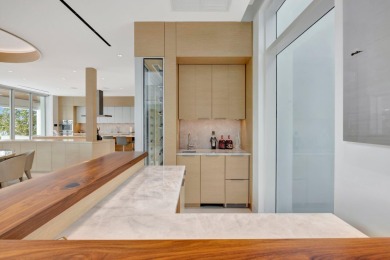 Experience the best of luxury living in this waterfront coastal on Sailfish Point Golf Club, Inc. in Florida - for sale on GolfHomes.com, golf home, golf lot