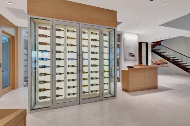 Experience the best of luxury living in this waterfront coastal on Sailfish Point Golf Club, Inc. in Florida - for sale on GolfHomes.com, golf home, golf lot