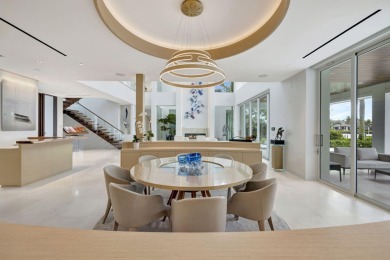 Experience the best of luxury living in this waterfront coastal on Sailfish Point Golf Club, Inc. in Florida - for sale on GolfHomes.com, golf home, golf lot