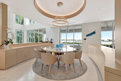 Experience the best of luxury living in this waterfront coastal on Sailfish Point Golf Club, Inc. in Florida - for sale on GolfHomes.com, golf home, golf lot