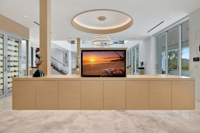 Experience the best of luxury living in this waterfront coastal on Sailfish Point Golf Club, Inc. in Florida - for sale on GolfHomes.com, golf home, golf lot